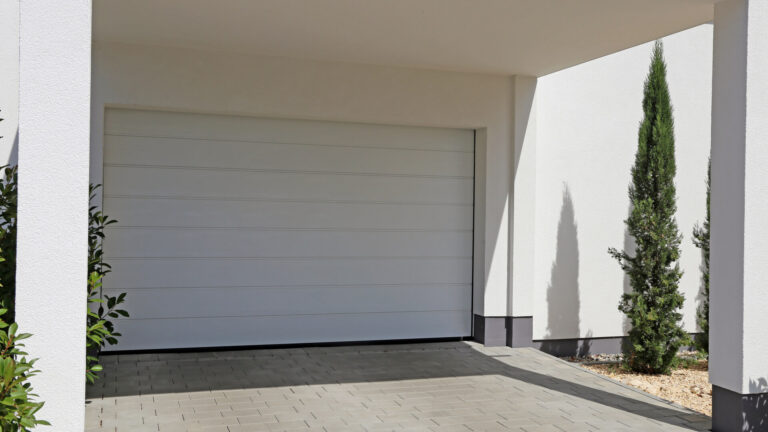 White Contemporary Home Sectional Garage Door Installation